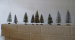 The little parade of trees on the mantel.